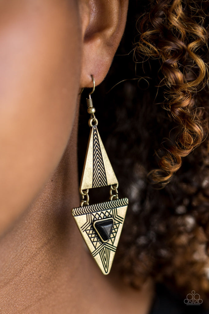 Stamped in tribal-inspired patterns, two triangular frames connect into a bold lure. Chiseled into a matching triangle, an earthy black stone is pressed into the bottom frame for a seasonal finish. Earring attaches to a standard fishhook fitting.  Sold as one pair of earrings.