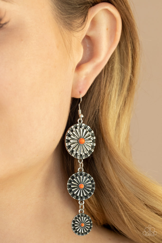 Dotted with dainty orange beads, rustic silver floral frames gradually decrease in size as they swing from the ear, creating a colorful lure. Earring attaches to a standard fishhook fitting.  Sold as one pair of earrings.