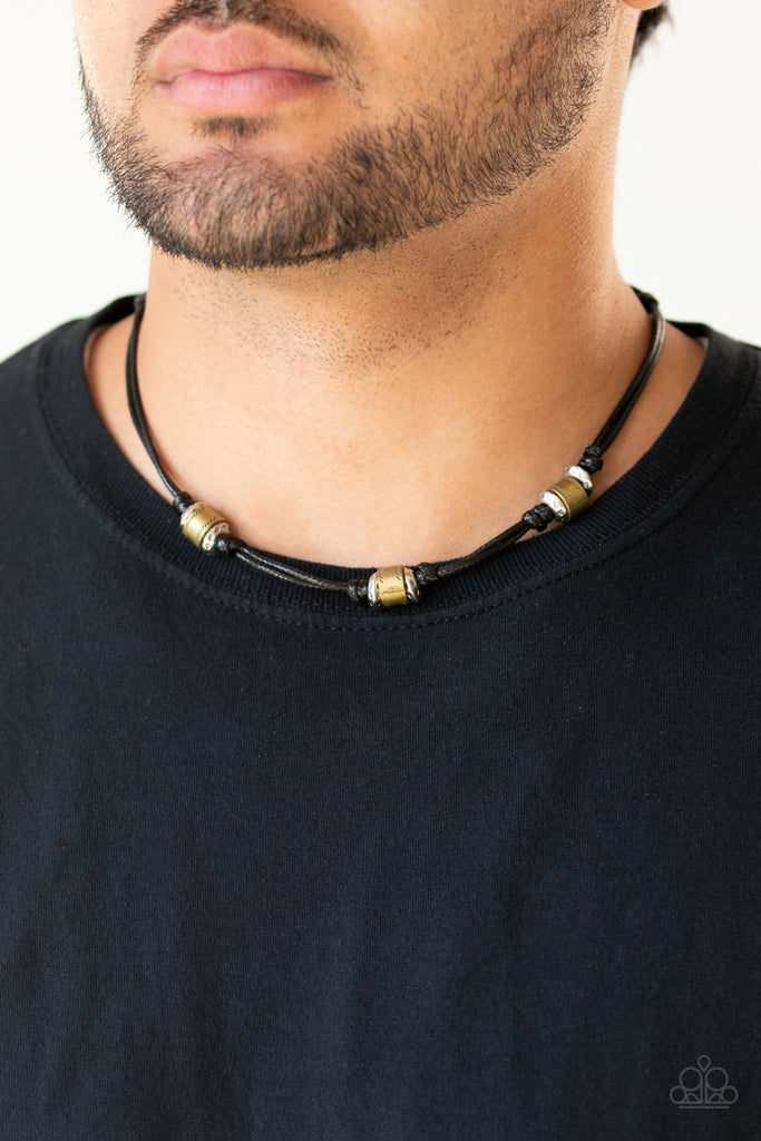 Sections of hammered silver discs and stamped brass rings are knotted in place along strands of shiny black cording that loops around the neck for a rustic look. Features a button loop closure.  Sold as one individual necklace.