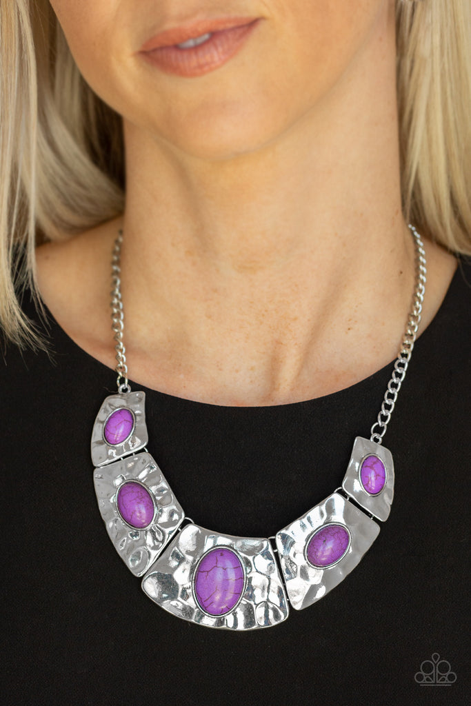Dotted with earthy purple stone accents, a collection of hammered silver plates link below the collar for an artisan-inspired look. Features an adjustable clasp closure.    Sold as one individual necklace. Includes one pair of matching earrings.