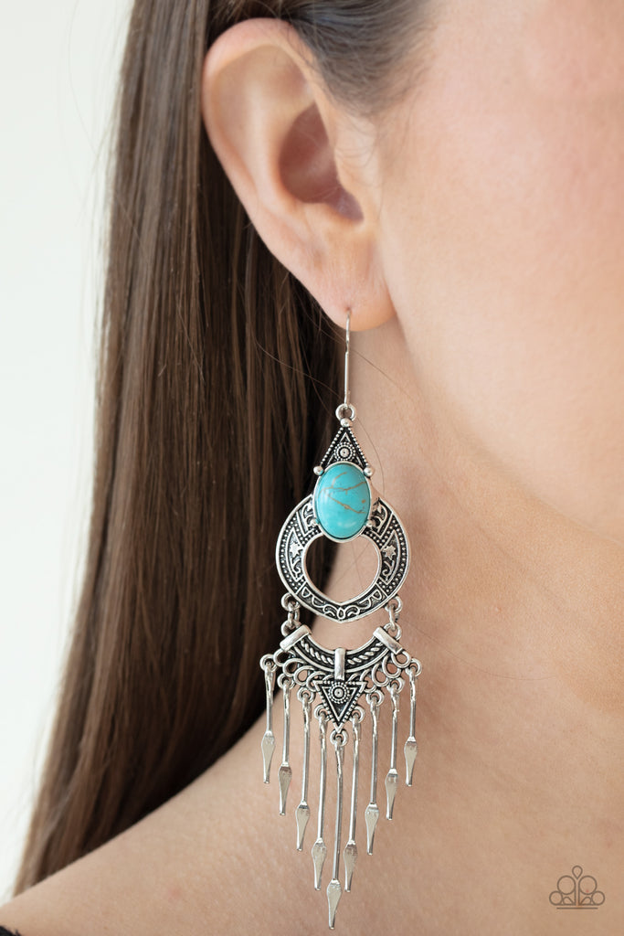 Spear-shaped silver bars dangle from the bottom of an ornately stacked blue stone encrusted frame, creating a tapered fringe. Earring attaches to a standard fishhook fitting.  Sold as one pair of earrings.