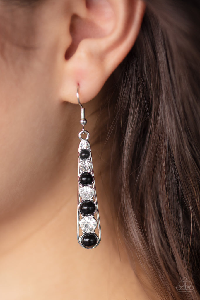 Gradually increasing in size, classic white rhinestones and shiny black beads alternate across the front of a shimmery silver teardrop frame, creating a refined lure. Earring attaches to a standard fishhook fitting.  Sold as one pair of earrings.