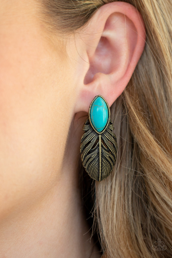 Chiseled into a tranquil marquise, a refreshing turquoise stone is pressed into the top of an antiqued brass frame for a seasonal look. Earring attaches to a standard post fitting.