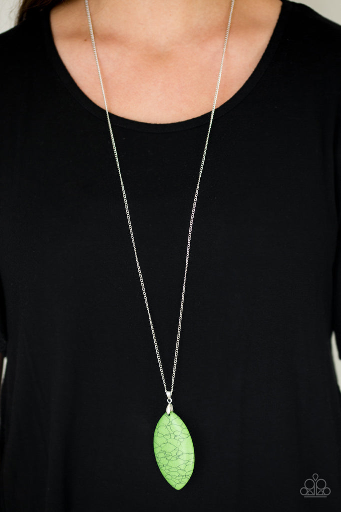 Chiseled to a tranquil almond-shape, an over sized green stone pendant swings from the bottom of a lengthened silver chain in a seasonal fashion. Features an adjustable clasp closure.  Sold as one individual necklace. Includes one pair of matching earrings.