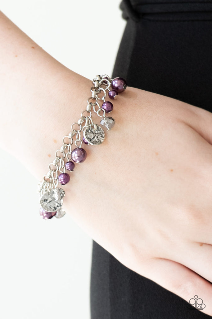 Pearly purple beads, smoky crystal-like gems, and hammered silver discs swing from a bold silver chain, creating a refined fringe around the wrist. Features an adjustable clasp closure.  Sold as one individual bracelet. 