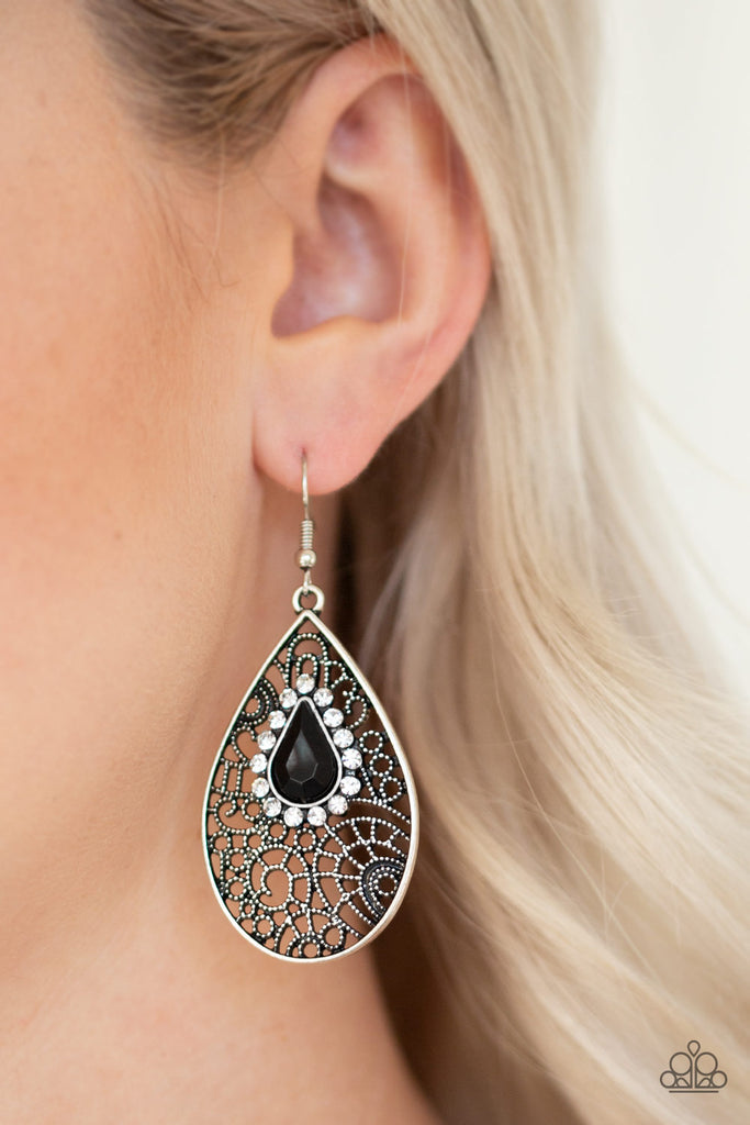 Ringed in glassy white rhinestones, a teardrop black bead is pressed into a shimmery silver frame radiating with airy filigree for a refined fashion. Earring attaches to a standard fishhook fitting.  Sold as one pair of earrings.