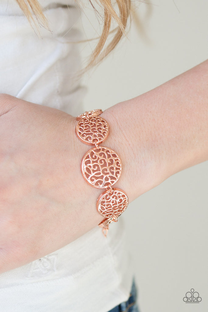 Filled with whirling filigree centers, shiny copper frames link around the wrist for a whimsical look. Features an adjustable clasp closure.  Sold as one individual bracelet.