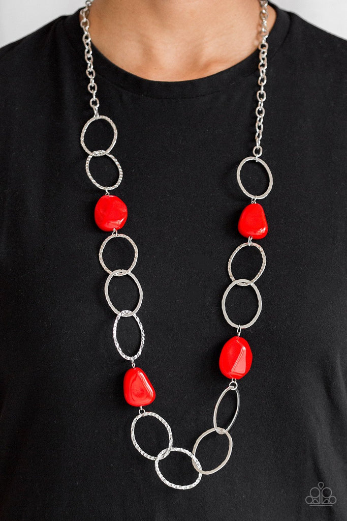 Featuring a faux rock finish, faceted red beads join hammered silver hoops across the chest for a seasonal look. Features an adjustable clasp closure.  Sold as one individual necklace. Includes one pair of matching earrings.