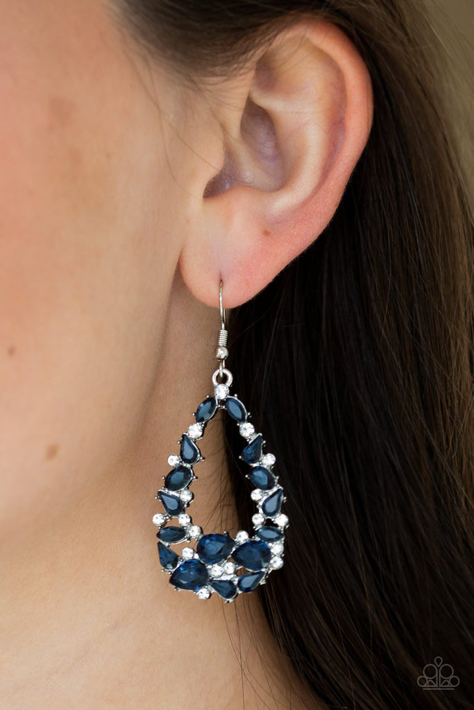 Varying in size and shape, a refined collection of glittery blue and white rhinestones are encrusted along a shimmery silver teardrop frame for a timeless look. Earring attaches to a standard fishhook fitting.  Sold as one pair of earrings.