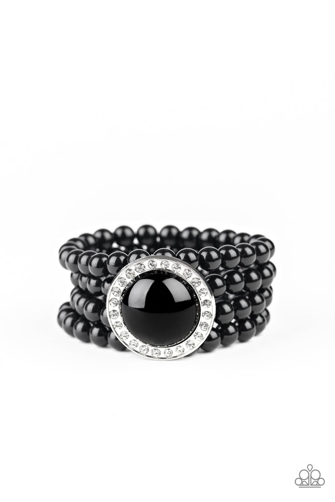 Threaded along stretchy bands, row after row of black beads are held in place by an exaggerated black beaded frame encrusted in glassy white rhinestones for a refined finish.  Sold as one individual bracelet.