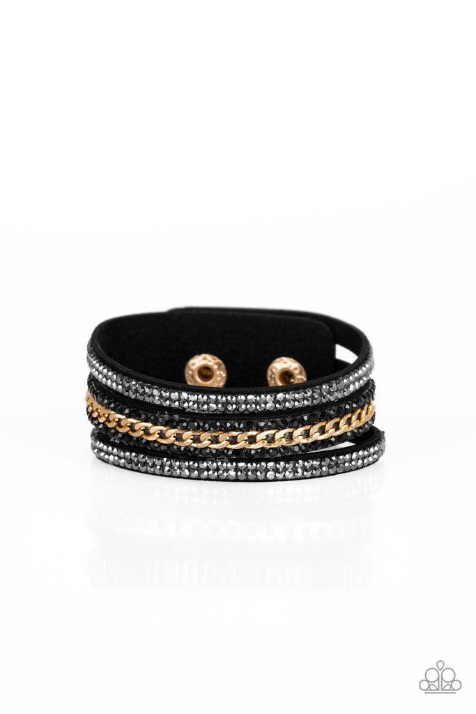 Rollin' In Rhinestones Rows of glassy hematite and black rhinestones and a shimmery gold chain are encrusted along black suede bands for a sassy look. Features an adjustable snap closure.  Sold as one individual bracelet.
