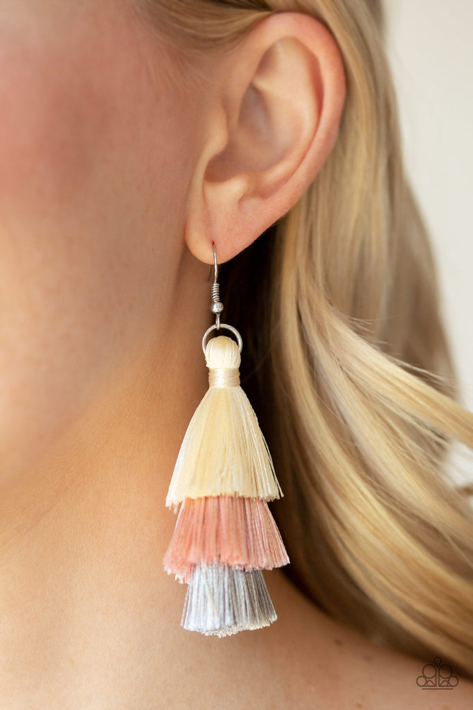 Featuring white, pink, and gray thread, a 3-tiered tassel swings from the ear for a flirtatious look. Earring attaches to a standard fishhook fitting.  Sold as one pair of earrings.