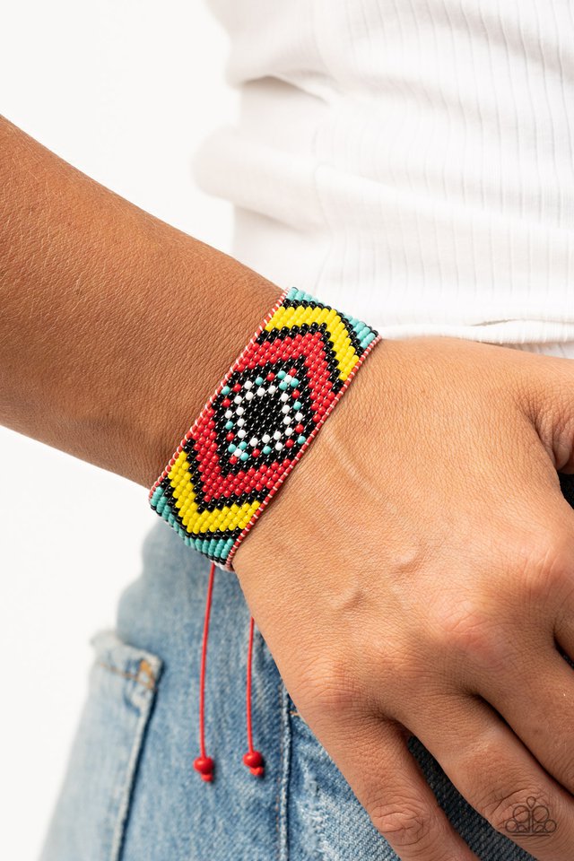 A dainty collection of red, black, yellow, white, and turquoise beads are delicately weaved into a colorful textile pattern across the wrist for a southwestern inspired fashion. Features an adjustable sliding knot closure.  Sold as one individual bracelet.