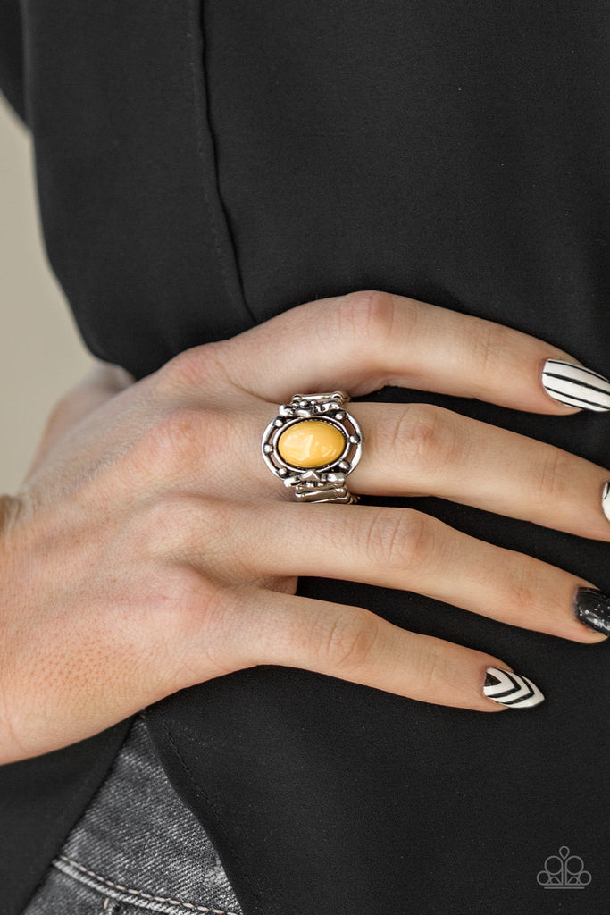 A polished yellow bead is pressed into the center of a silver frame blooming with floral details for a whimsical finish. Features a stretchy band for a flexible fit.  Sold as one individual ring.