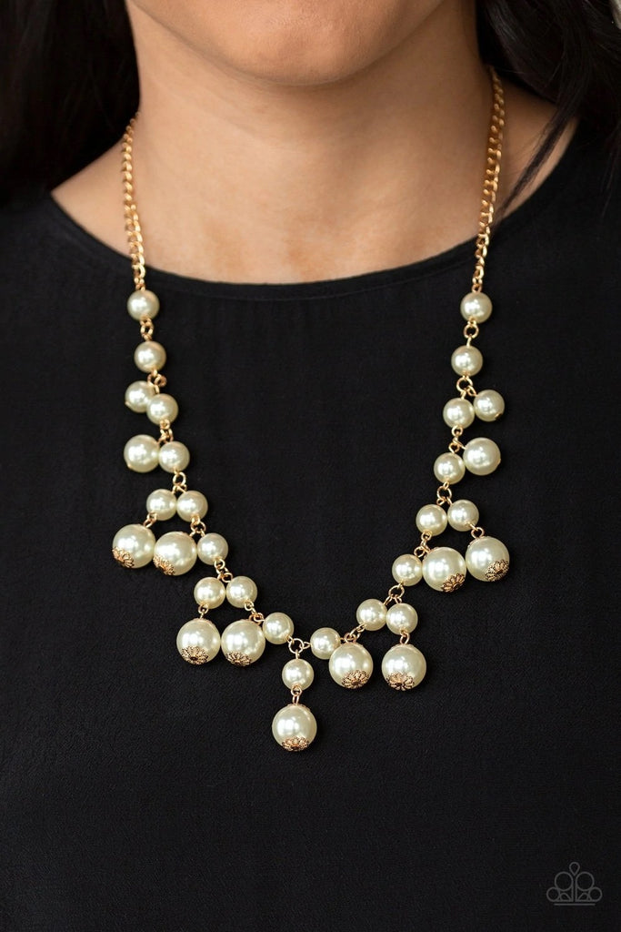 Varying in size, bubbly white pearls swing from the bottom of a classic strand of pearls, creating a refined fringe below the collar. Features an adjustable clasp closure.  Sold as one individual necklace. Includes one pair of matching earrings.