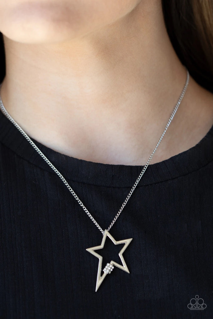 Infused with a dainty white rhinestone beaded accent, a striking silver star glides along a shiny silver chain below the collar, creating a stellar pendant. Features an adjustable clasp closure.  Sold as one individual necklace. Includes one pair of matching earrings.
