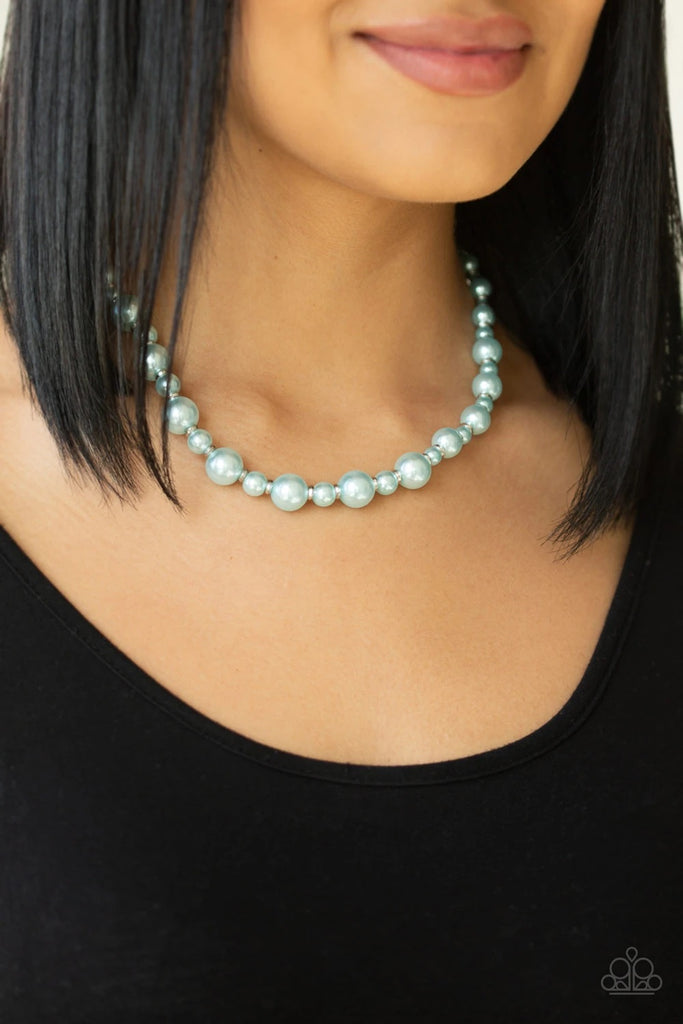 Infused with dainty silver accents, a collection of dainty and classic blue pearls are threaded along an invisible wire below the collar for a timeless look. Features an adjustable clasp closure.  Sold as one individual necklace. Includes one pair of matching earrings.