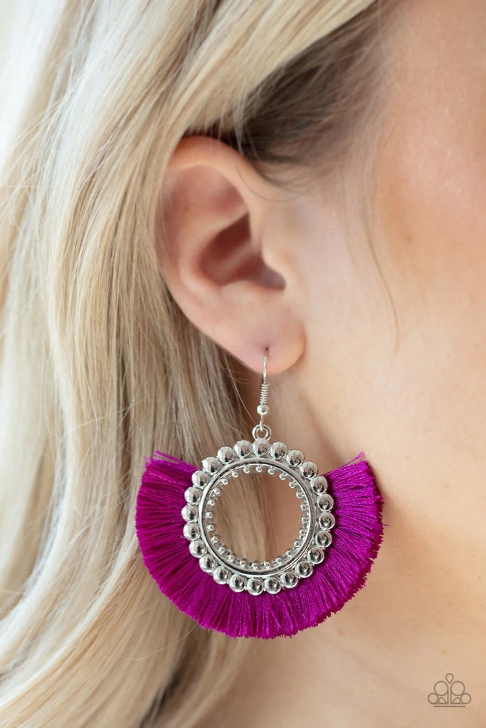 Neon purple thread flares out from the bottom of a bubbly silver hoop, creating a vivacious fringe. Earring attaches to a standard fishhook fitting.  Sold as one pair of earrings.