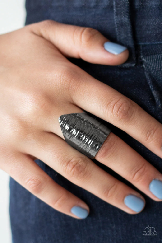 Engraved in linear textures, an abstract triangular gunmetal frame folds around the finger for a bold look. Features a stretchy band for a flexible fit.  Sold as one individual ring.