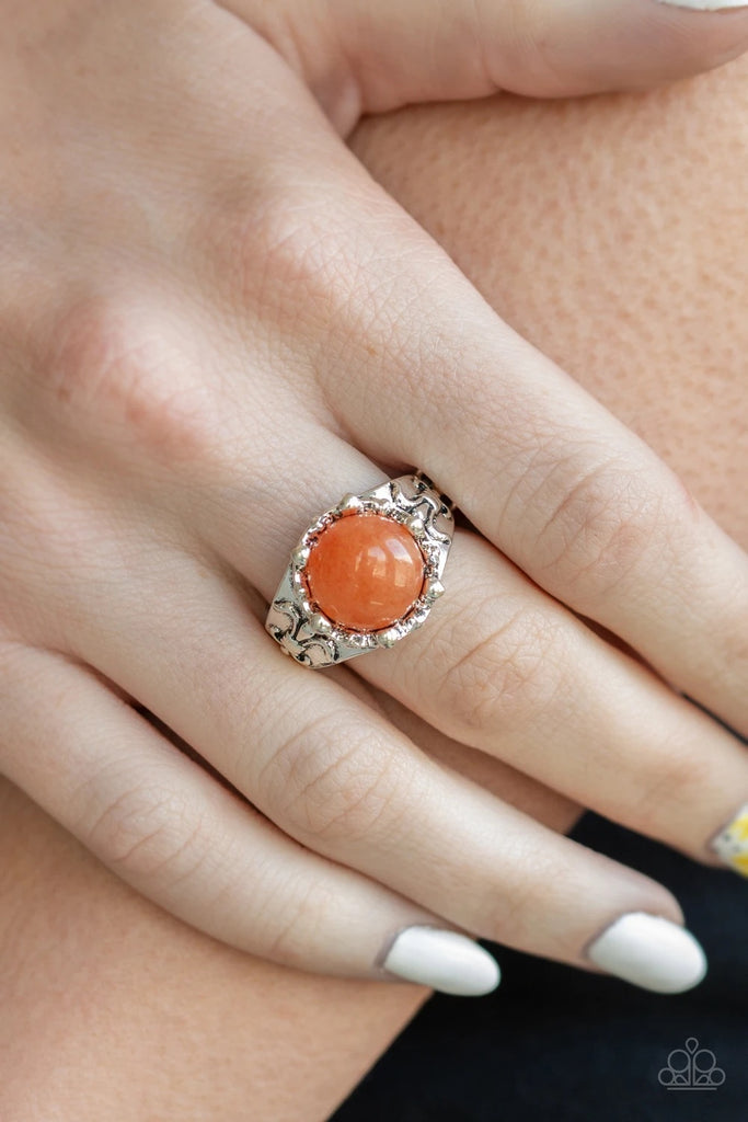 A glassy orange stone is pressed into the center of a dainty silver band embossed in tribal inspired patterns for a seasonal look. Features a dainty stretchy band for a flexible fit.  Sold as one individual ring.