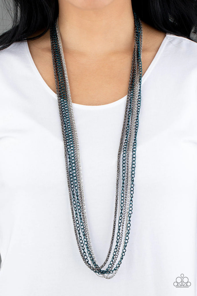 Brushed in a metallic finish, blue chains collide with mismatched gunmetal and silver chains across the chest. Shimmery silver and gunmetal popcorn chains join the colorful layers, adding shimmery metallic texture to the spunky mixed palette. Features an adjustable clasp closure.  Sold as one individual necklace. Includes one pair of matching earrings.