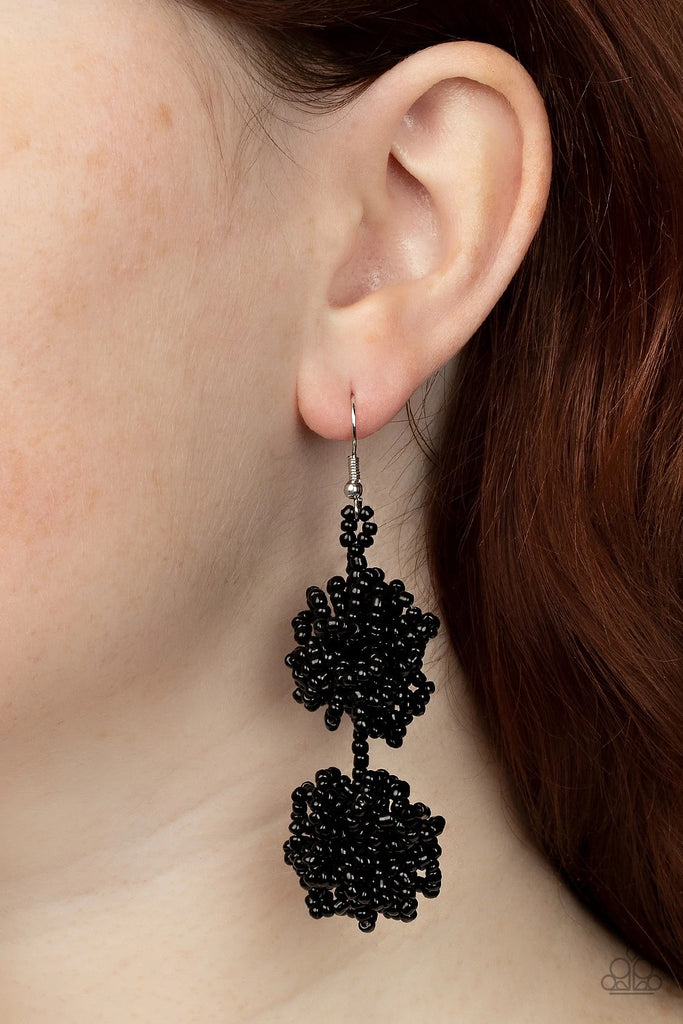 Strands of shiny black seed beads delicately knot into an elegantly clustered lure, creating a stellar modern look. Earring attaches to a standard fishhook fitting.  Sold as one pair of earrings.