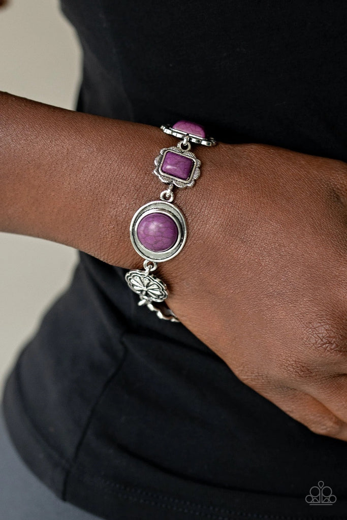 Featuring vivacious Magenta Purple stone centers, a collection of antiqued silver frames link with a decorative floral charm around the wrist for a seasonal flair. Features an adjustable clasp closure.  Sold as one individual bracelet.
