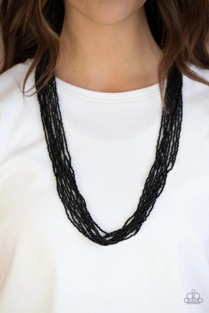 Suspended between two silver fittings, strands of countless black seed beads layer across the chest for a vivacious look. Features an adjustable clasp closure.  Sold as one individual necklace. Includes one pair of matching earrings.