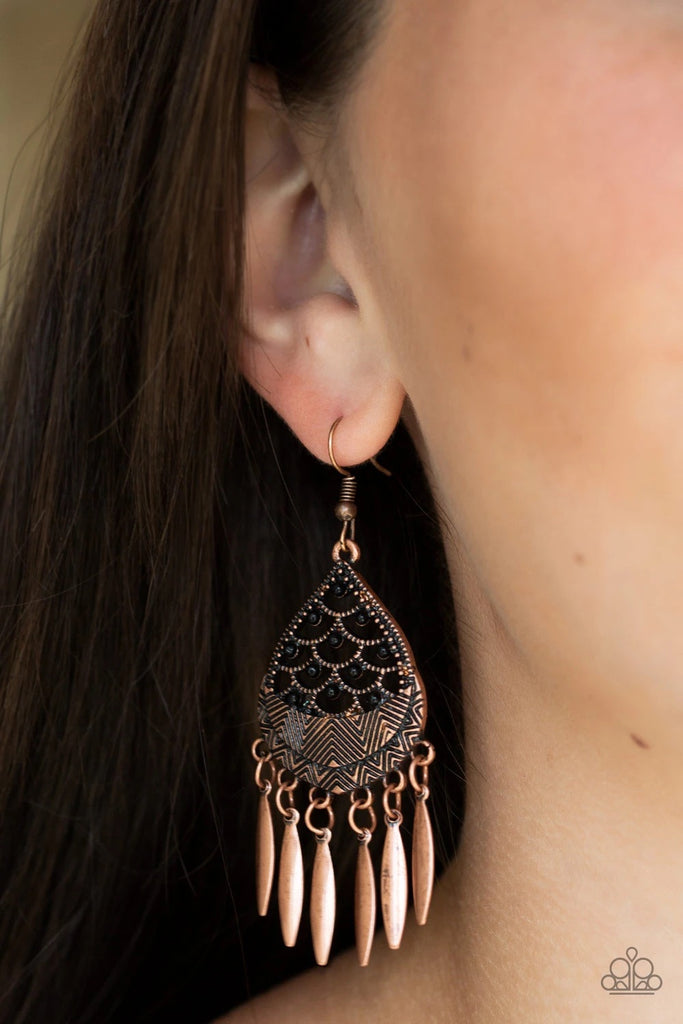 Etched in zigzagging textures, a black beaded copper frame gives way to a fringe of flared copper bars for a dramatic tribal inspired look. Earring attaches to a standard fishhook fitting.  Sold as one pair of earrings.