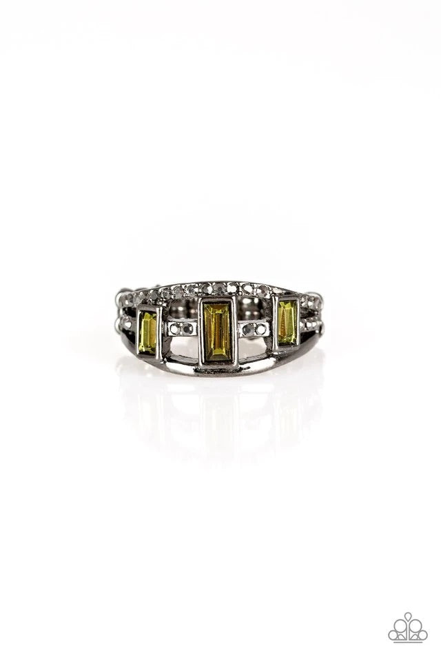 Three green emerald-cut rhinestones are encrusted along three gunmetal bands radiating with smooth surfaces and sections of glittery hematite rhinestones for an edgy fashion. Features a stretchy band for a flexible fit.  Sold as one individual ring.
