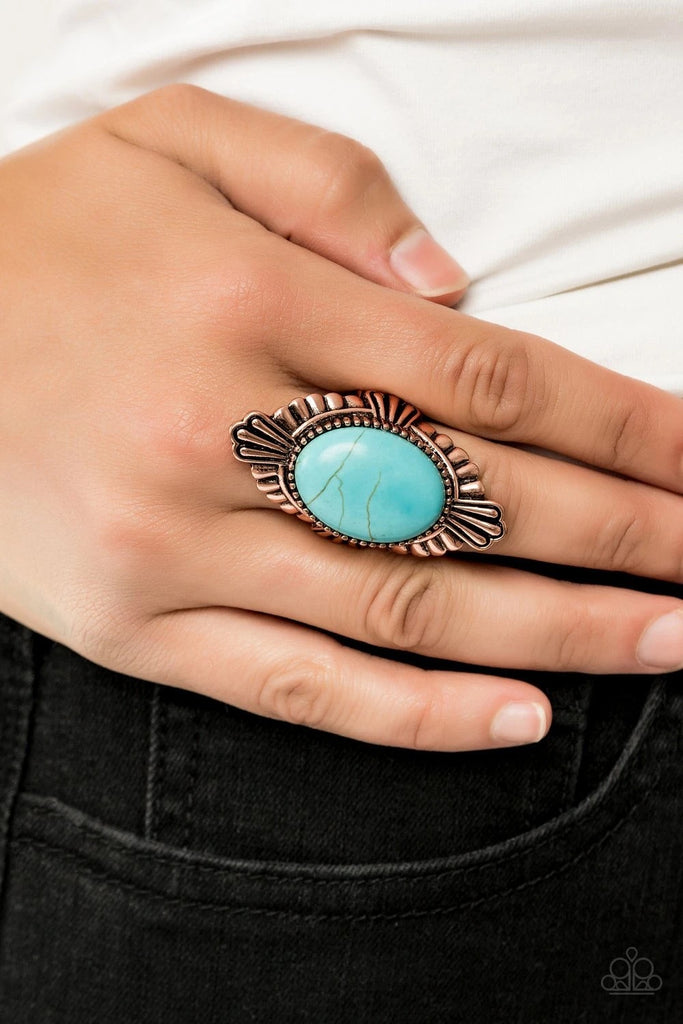 Featuring antiqued linear textures, a scalloped copper frame flares out from a dramatically oversized turquoise stone center for a seasonal look. Features a stretchy band for a flexible fit.  Sold as one individual ring.
