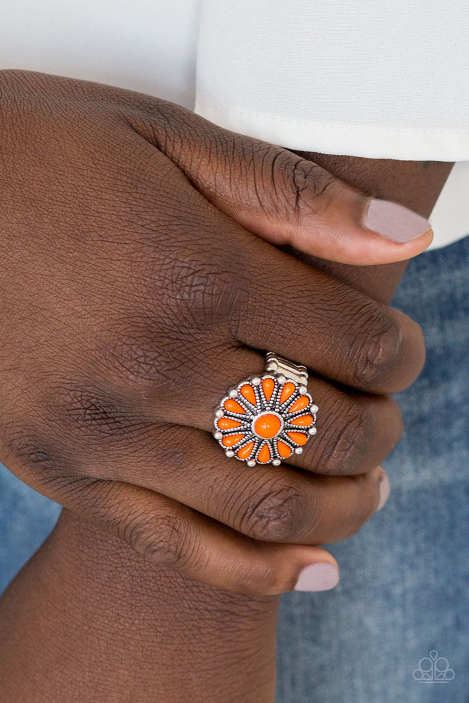 Vivacious orange beads spin around a studded silver frame, creating a colorful floral pattern atop the finger. Features a stretchy band for a flexible fit.  Sold as one individual ring.  