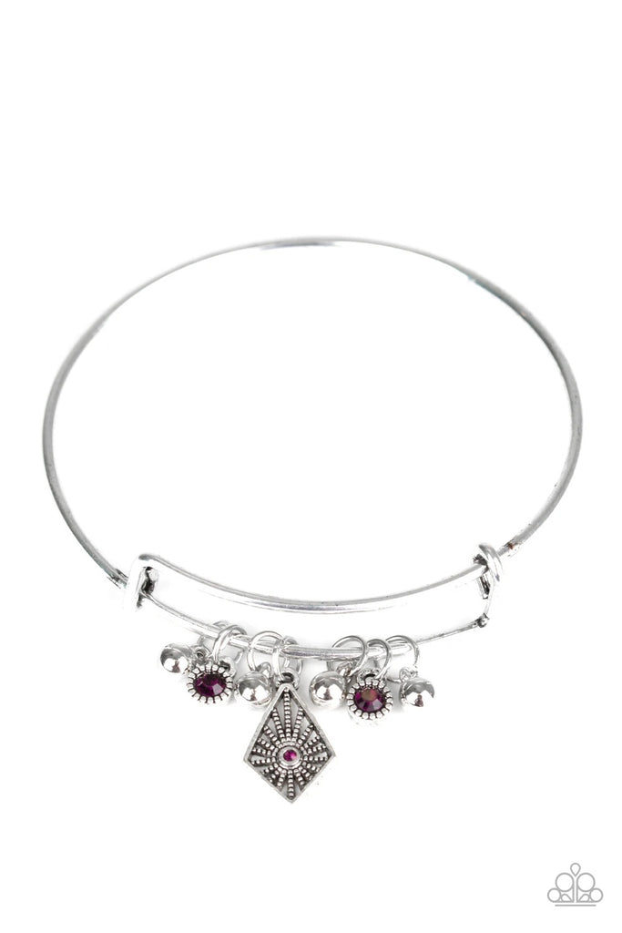 A collection of shimmery silver beads and glittery purple rhinestone accents slide along a sleek bar fitting, creating whimsical charms as they glide along the dainty silver bangle.  Sold as one individual bracelet.