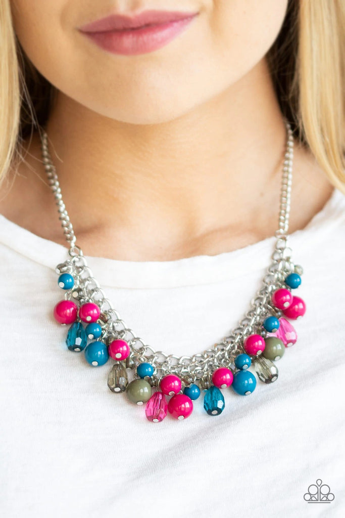 Varying in shape, glassy and polished blue, green, and pink beads swing from the bottom of interlocking silver chains. Crystal-like teardrops are sprinkled along the colorful beading, creating a flirtatious fringe below the collar. Features an adjustable clasp closure.  Sold as one individual necklace. Includes one pair of matching earrings.