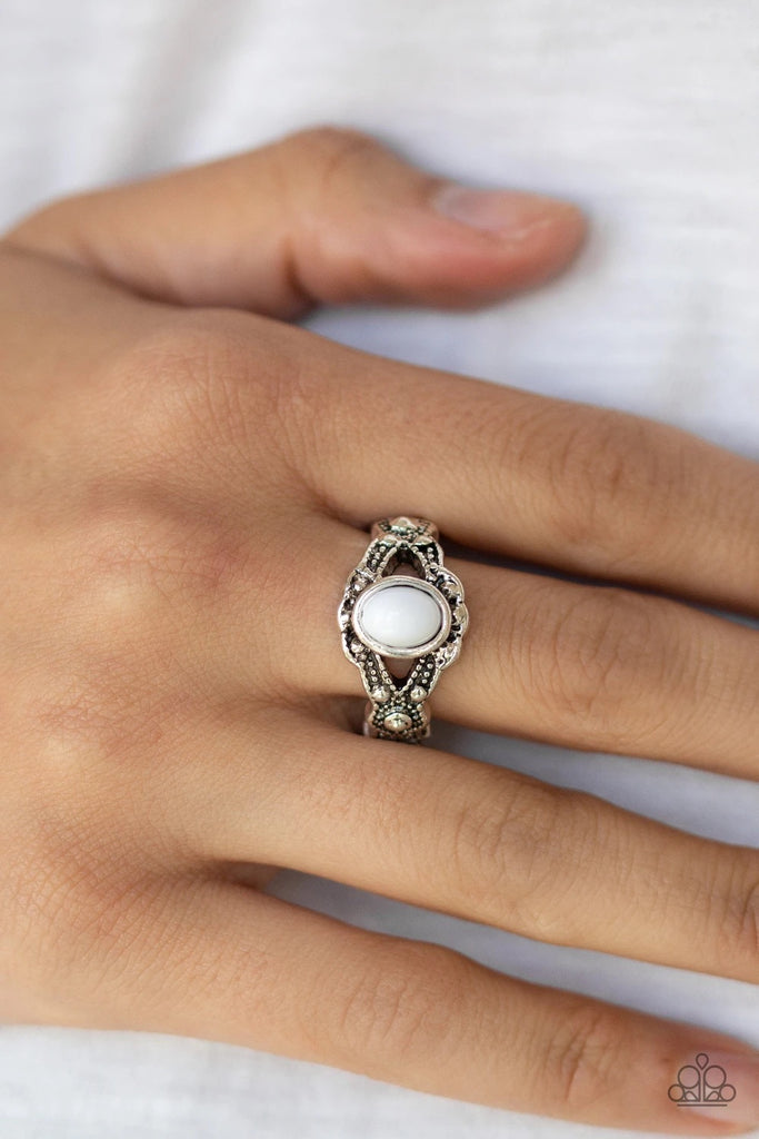 A shiny white bead dots the center of a dainty silver band radiating with studded texture for a whimsical look. Features a dainty stretchy band for a flexible fit.  Sold as one individual ring.