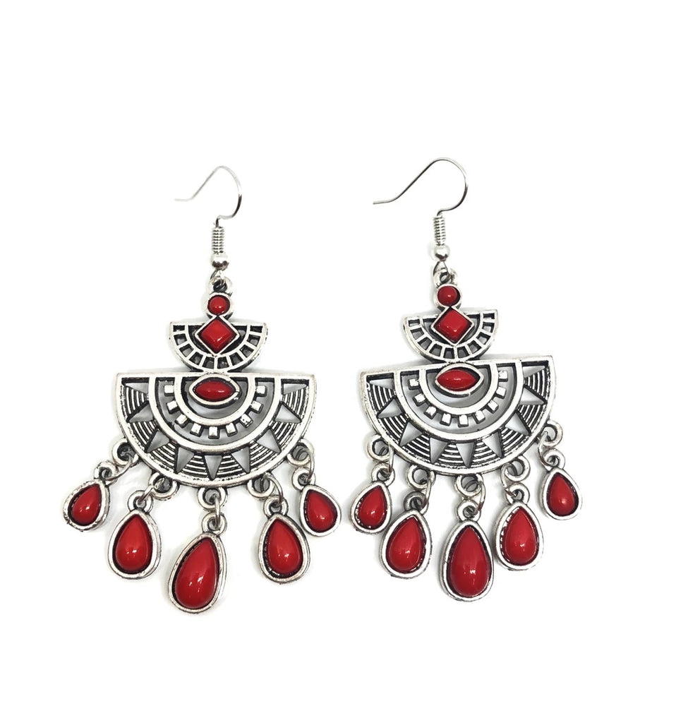 Radiating with sunburst patterns, a red beaded silver frame gives way to a matching red teardrop fringe for a seasonal flair. Earring attaches to a standard fishhook fitting.     Sold as one individual pair of earrings.