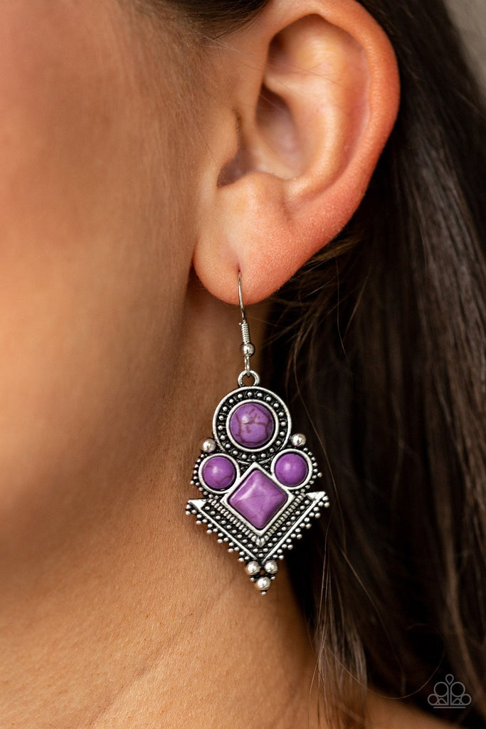 Chiseled into round and square beads, vivacious purple stones are pressed into an ornate geometric frame radiating with shimmery silver studs for a tribal inspired look. Earring attaches to a standard fishhook fitting.  Sold as one pair of earrings.