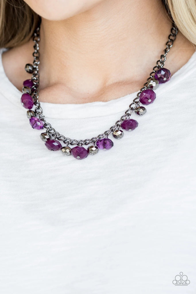 Featuring cloudy and glassy finishes, faceted purple crystal-like beads swing from the bottom of a glistening gunmetal chain. Faceted gunmetal beads join the purple beading, creating a flirtatious fringe below the collar. Features an adjustable clasp closure.  Sold as one individual necklace. Includes one pair of matching earrings.
