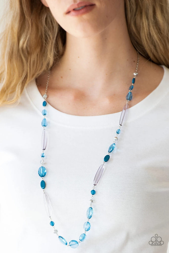 Varying in shape and shimmer, faceted blue and metallic crystal-like beads trickle down the chest for a whimsical look. Features an adjustable clasp closure.  Sold as one individual necklace. Includes one pair of matching earrings.