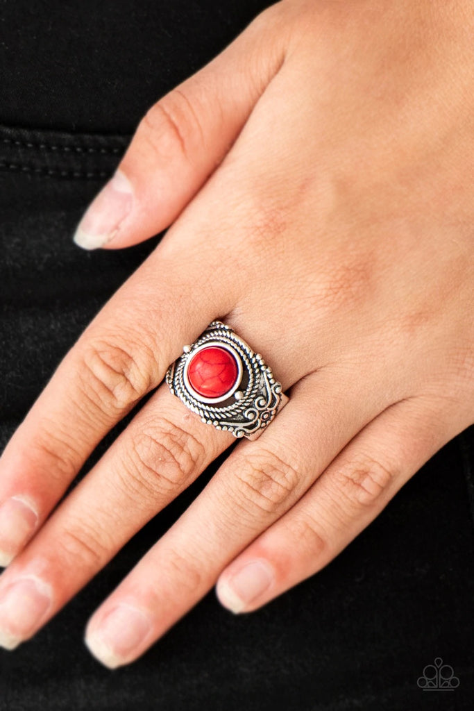 A fiery red stone is pressed into an ornate silver band radiating with rope-like and studded textures for a seasonal look. Features a stretchy band for a flexible fit.  Sold as one individual ring.