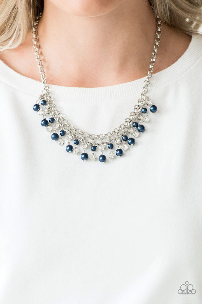 Glittery white rhinestones and classic blue pearls swing from the bottom of interlocking silver chains, creating a bubbly fringe below the collar. Features an adjustable clasp closure.  Sold as one individual necklace. Includes one pair of matching earrings.