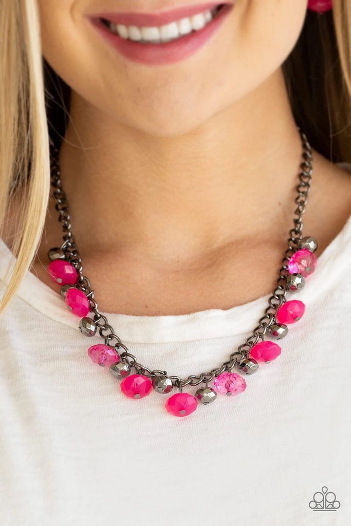 Featuring cloudy and glassy finishes, faceted pink crystal-like beads swing from the bottom of a glistening gunmetal chain. Faceted gunmetal beads join the pink beading, creating a flirtatious fringe below the collar. Features an adjustable clasp closure.  Sold as one individual necklace. Includes one pair of matching earrings.