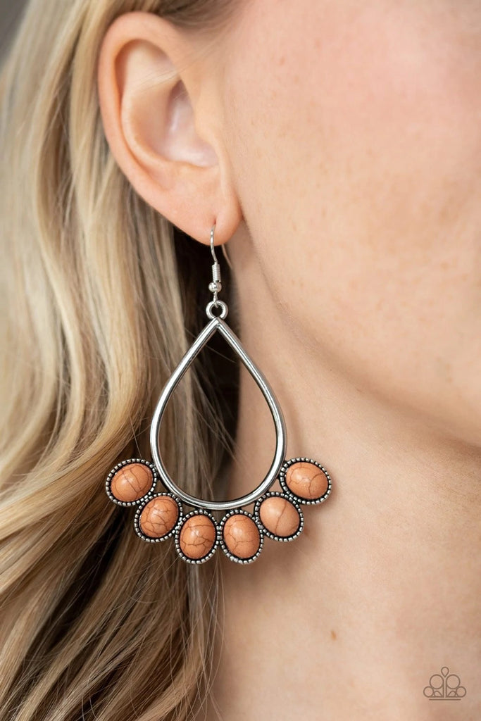 Featuring decorative silver fittings, smooth brown stones fan out from the bottom of an airy silver teardrop frame for a seasonal flair. Earring attaches to a standard fishhook fitting.  Sold as one pair of earrings.