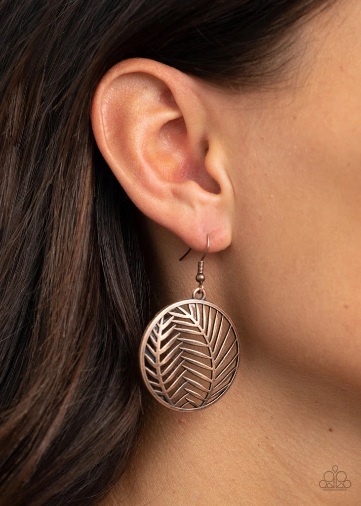 Brushed in an antiqued shimmer, beveled palm leaves delicately connect inside a copper hoop, creating a whimsical frame. Earring attaches to a standard fishhook fitting.  Sold as one pair of earrings.