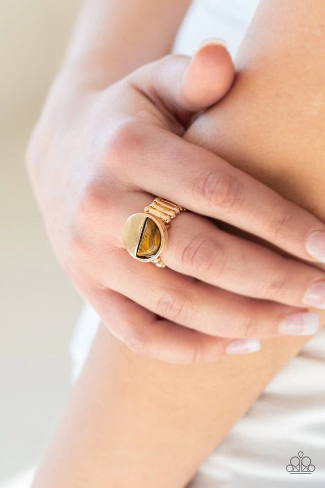 Chiseled into a tranquil crescent shape, a radiant Tiger's Eye stone is pressed into the bottom half of a circular gold frame for an on-trend look. Features a stretchy band for a flexible fit. Sold as one individual ring.