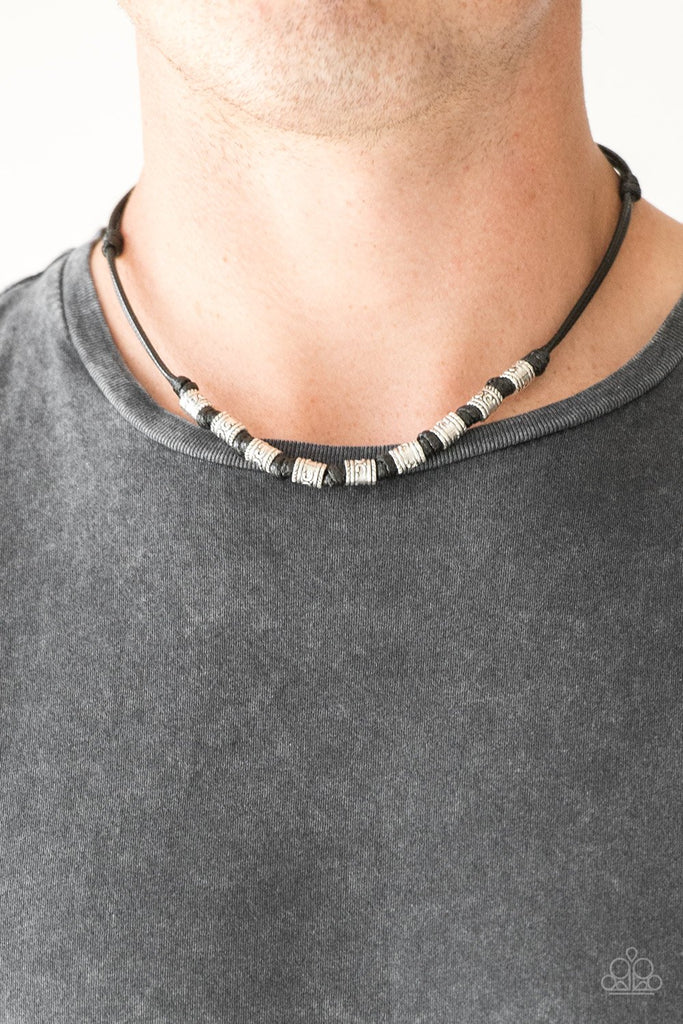 Decorative silver beads are knotted in place along a shiny black cord below the collar for a seasonal look. Features a button loop closure.  Sold as one individual necklace.
