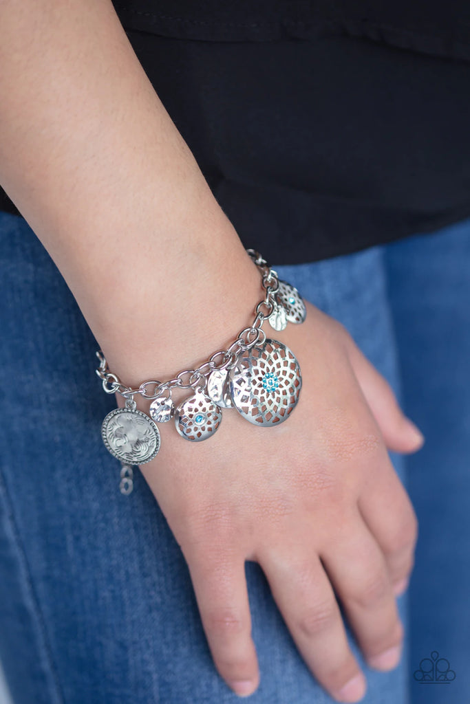 Dotted with dainty blue rhinestones, mandala-like silver charms join hammered silver discs along a thick silver chain, creating whimsical charms. Features an adjustable clasp closure.  Sold as one individual bracelet.