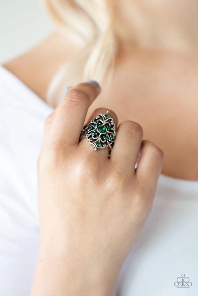Dotted in dainty green rhinestones, regal silver frames vine out from a classic green rhinestone center for a refined flair. Features a stretchy band for a flexible fit.  Sold as one individual ring.