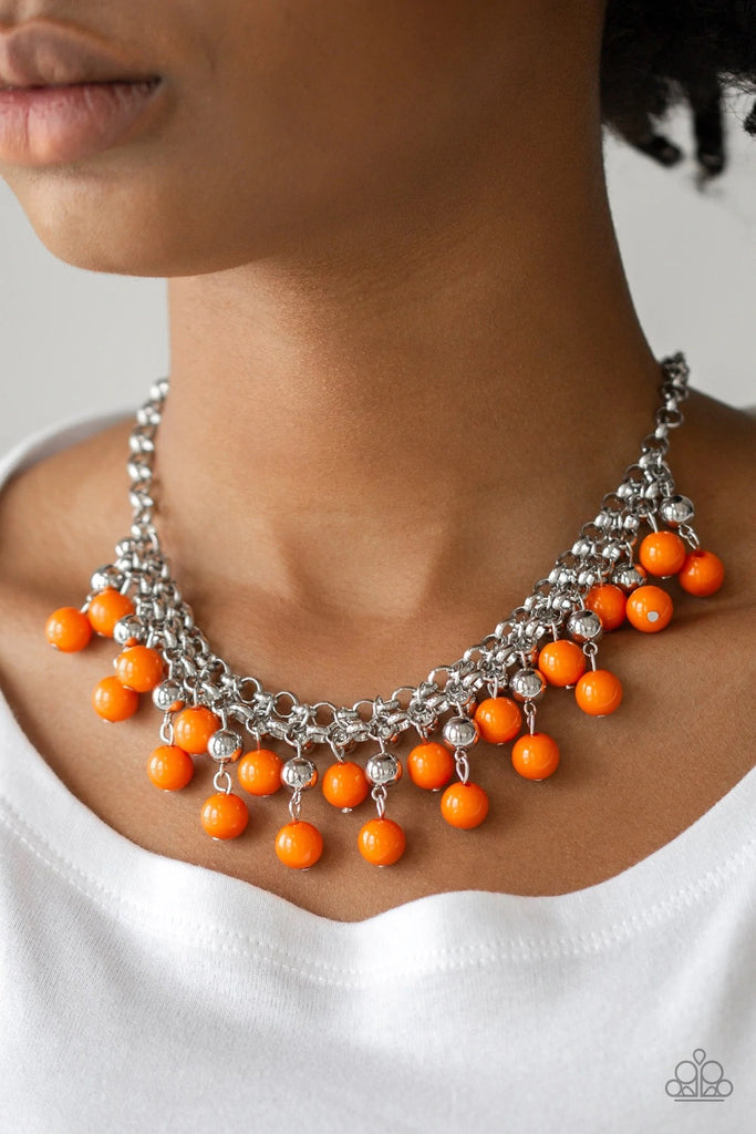 Rows of classic silver and vivacious orange beads trickle from two rows of interlocking silver chains, creating a bold colorful fringe below the collar. Features and adjustable clasp closure.  Sold as one individual necklace. Includes one pair of matching earrings.
