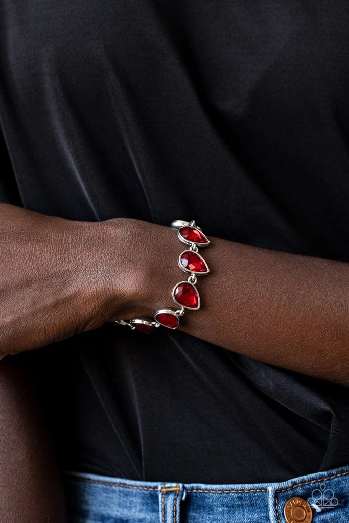 Featuring sleek silver fittings, an exaggerated display of oversized red teardrop gems delicately link around the wrist in a glamorous finish. Features an adjustable clasp closure.  Sold as one individual bracelet.